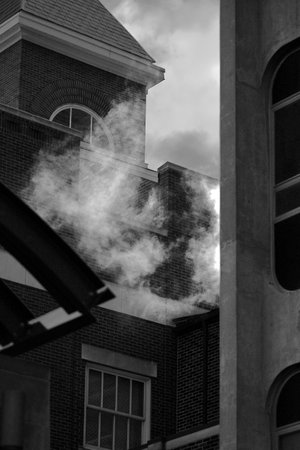 A vertical grayscale shot of a neighborhood with residential buildingsの写真素材