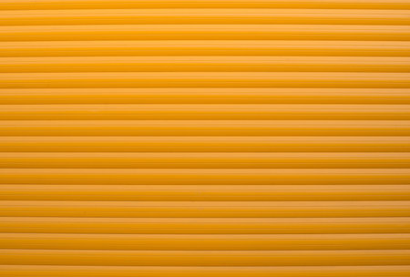 Textured wall structure, background with copy space for text, crunchy backdrop, orange window cover, close upの写真素材