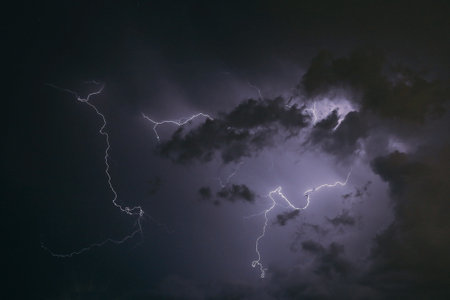 A dramatic shot of lightning on a stormy sky with long exposureの写真素材