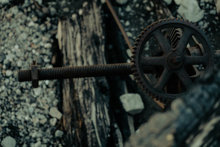 A steel gear in the rubble from a destroyed mechanical dam after a forest fire.の写真素材