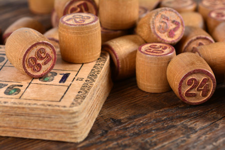 The wooden kegs and cards of a vintage lotto board gameの写真素材