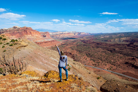 A cheerful young woman in the Capitol Reef National Park in Utah, the USAの写真素材