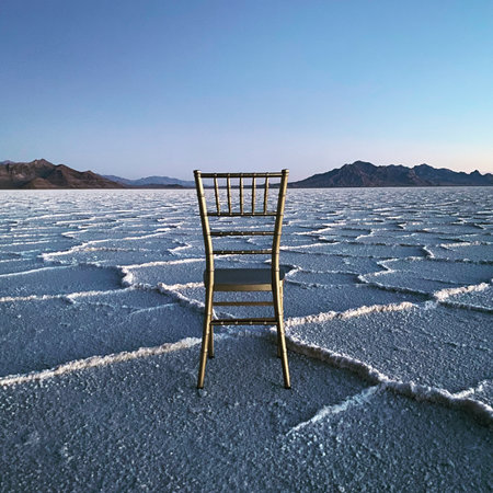 A chair at the world's largest salt flat, Salar de Uyuni in Bolivia at sunriseの写真素材
