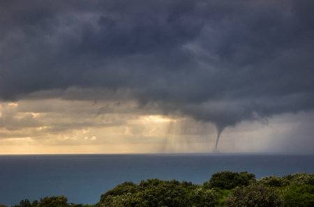 A tornadic waterspout on the sea on a stormy dayの写真素材