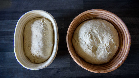 A top-view of of homemade sourdough in bowls before baking