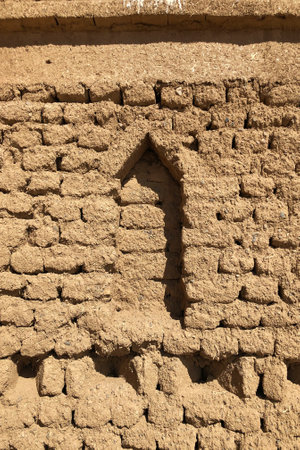 A vertical shot of a vintage construction detail in Merzouga, Moroccoの写真素材