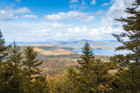 The view of Moosehead lake with early fall foliage. Maine, United States.の写真素材