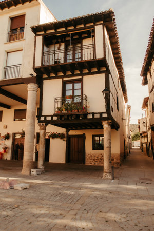 A vertical shot of the oldest house in Covarrubias, Burgos with a porch, columns, and balconiesの写真素材