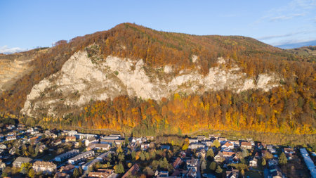 Aerial view during autumn of Peggau near Graz with the impressive rock face Peggauer Wand