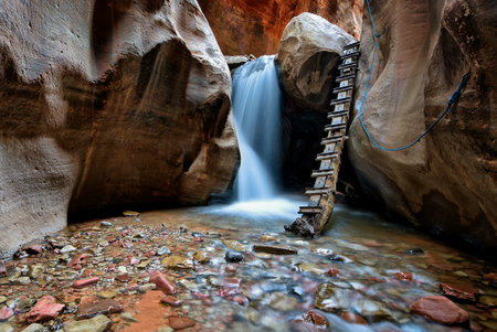 A mesmerizing waterfall in a canyon in Kanarraville, USAの写真素材