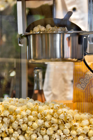 A closeup shot of a popcorn machine full of popcornの写真素材
