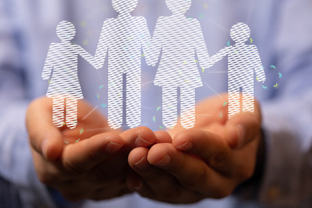 An abstract shot of male hands displaying 3D rendered family icons, adoption, foster careの写真素材