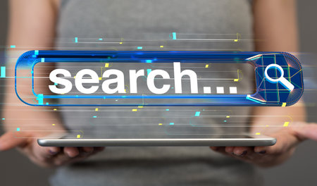 A 3D floating search interface above hands holding a tabletの写真素材