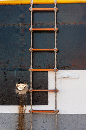 A closeup of an old ladder on a body of a ship in the USAの写真素材