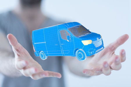A 3D rendering of a hologram wireframe van in a man's hands - logistics and delivery conceptの写真素材
