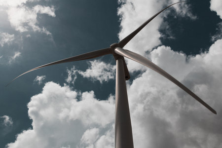 A low angle shot of a Wind Turbine against a cloudy sky in Santa Isabel, Puerto Rico