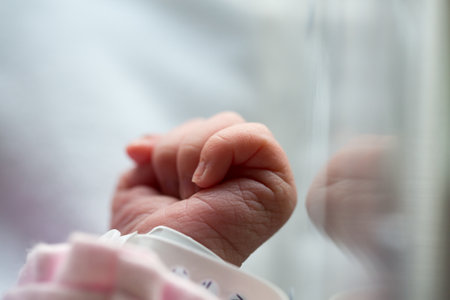 A shallow focus shot of a newborn baby handの写真素材