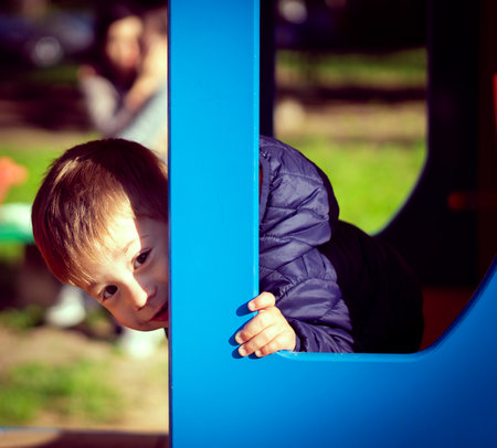 A little adorable Caucasian boy playing in the playの写真素材