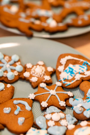 A selective focus shot of a delicious decorative cookies in a gray plates