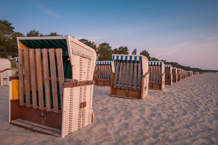 The wooden sun loungers on the sandy beachの写真素材