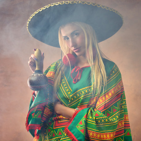 A beautiful Caucasian female dressed in Mexican national costumeの写真素材