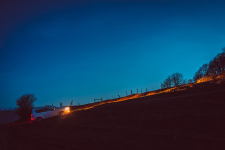 A beautiful view of a car in the village in the eveningの写真素材