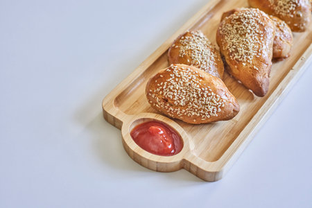 The homemade pies sprinkled with sesame seedsの写真素材