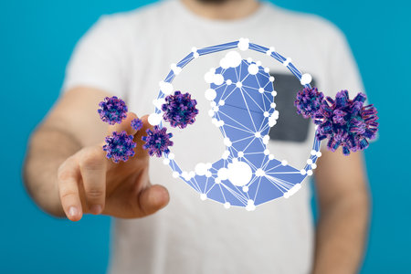 A person's hand touching the hologram of coronavirusの写真素材