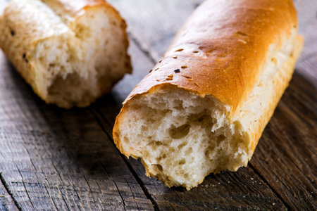 A closeup of french Baguettes bread on a wooden tableの写真素材