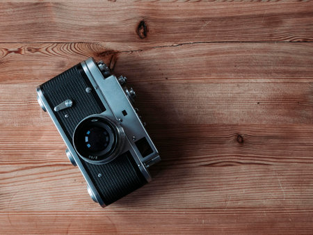 A closeup shot of a retro camera on a wooden surface