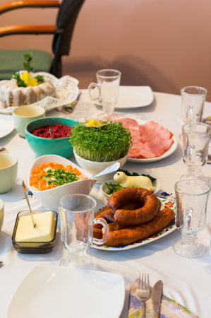A vertical shot of the delicious salads and sausages on the table