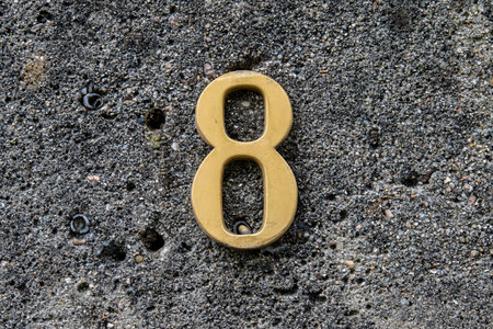 A Closeup of the number 8 on the wallの写真素材