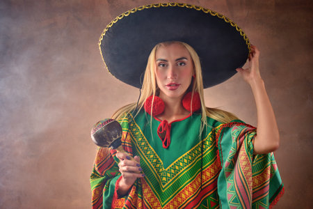 A beautiful Caucasian female dressed in Mexican national costumeの写真素材