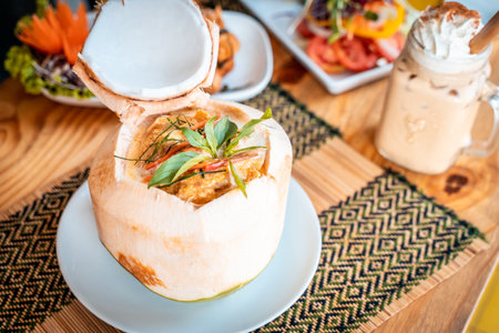 A closeup of the traditional Thai red coconut curry on the plateの写真素材