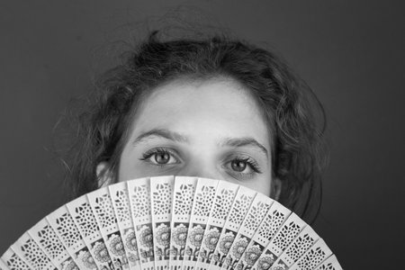 A grayscale shot of a Caucasian female with a partially closed face with a fの写真素材