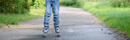 Incline Skating child, learning a new sport activity, outdoor, summertimeの写真素材