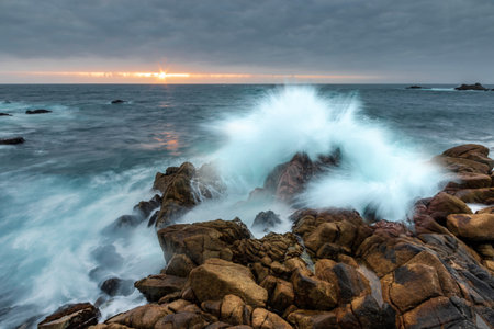 A beautiful view of big waves crashing at sunset