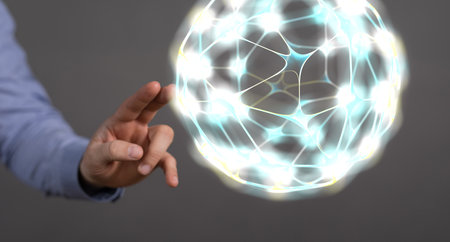 A 3D rendering of a hand touching an abstract ball with a network; the concept of the internet and technologyの写真素材