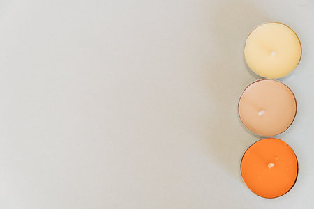 A closeup of decorative candles on a white background
