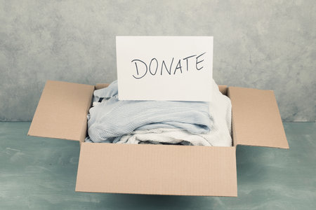 Package with used clothes for donation, second hand use for poor people, welfare