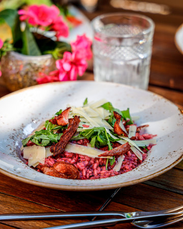 A vertical shot of a risotto rucola parmesanの写真素材