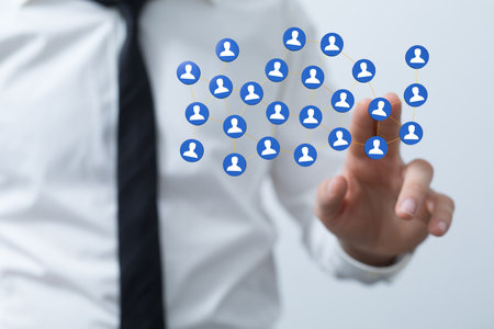 An abstract shot of male hands displaying contact icons connecting, networking in digital cyberspaceの写真素材