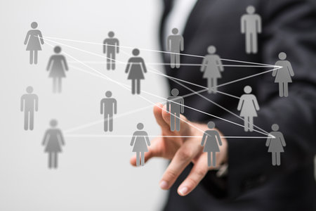 A 3D rendering of a businessman pointing at a group of people iconsの写真素材