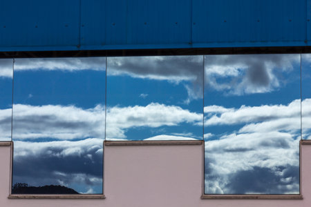 The clouds reflected in the glassの写真素材