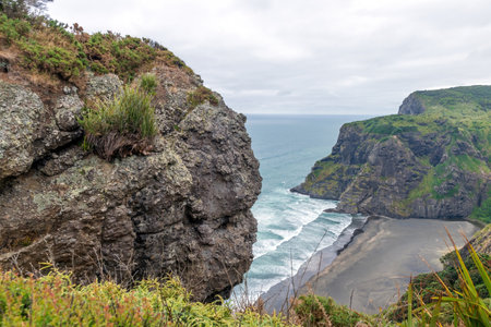 View of Te Ahua Point, Mercer Bay from Comans Track lookout at Karekare, Auckland, New Zealand