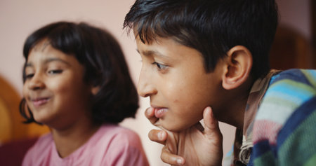 A closeup of the young boy's thinking face.の写真素材