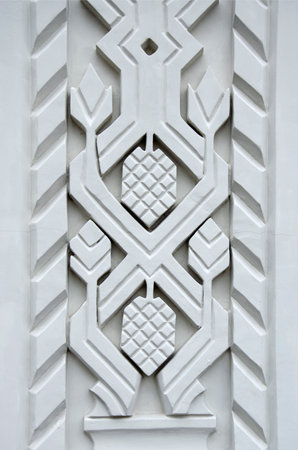A fragment of decorative elements on the wall of a historic building - architectural relief with...