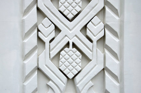 A fragment of decorative elements on the wall of a historic building - architectural relief with...