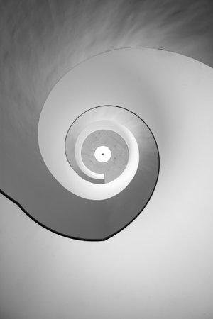 A low angle view of white wall and ceiling with shadowsの写真素材