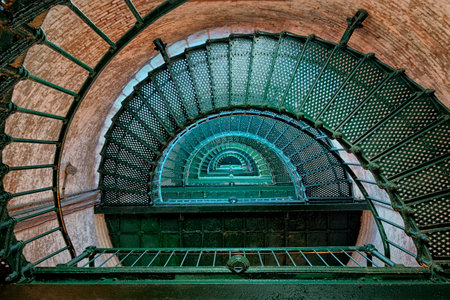 Green spiral staircase inside the Currituck Beach Lighthouse in Corolla, USAの写真素材